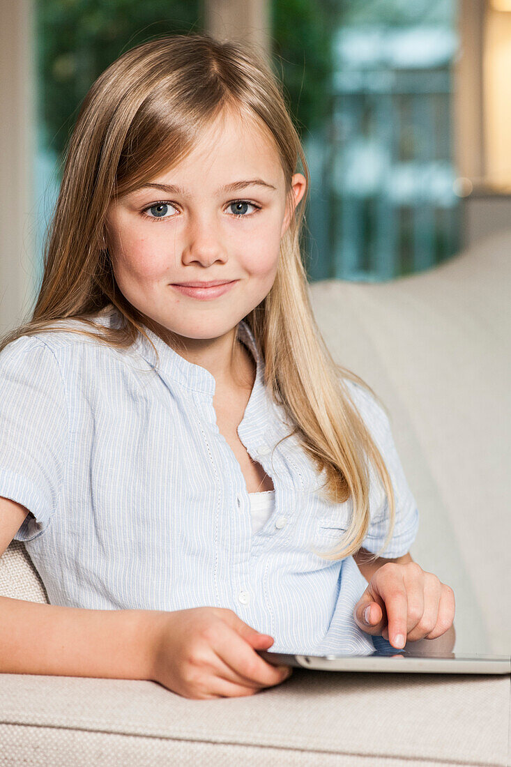 Girl using an iPad, Hamburg, Germany