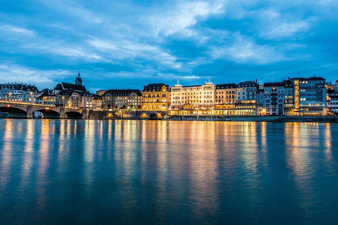 View over the river Rhine with Mittlere Bruecke (Middle Bridge) to a hotel in the evening, Basel, Canton of Basel-Stadt, Switzerland