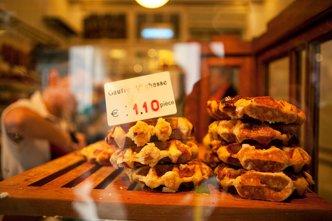 Belgian waffles behind a window of a bakery, Liege, Wallonia, Belgium