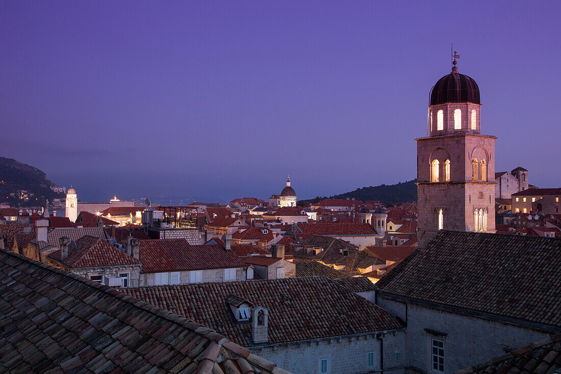 Old town rooftops with Franciscan Church monastery tower seen from the city wall at dusk, Dubrovnik, Dubrovnik-Neretva, Croatia
