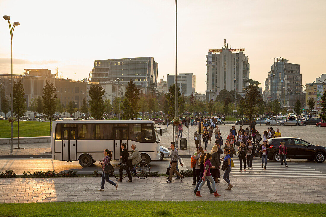 Pedestrians and Traffic near Skanderbeg Square at sunset, Tirana, Albania