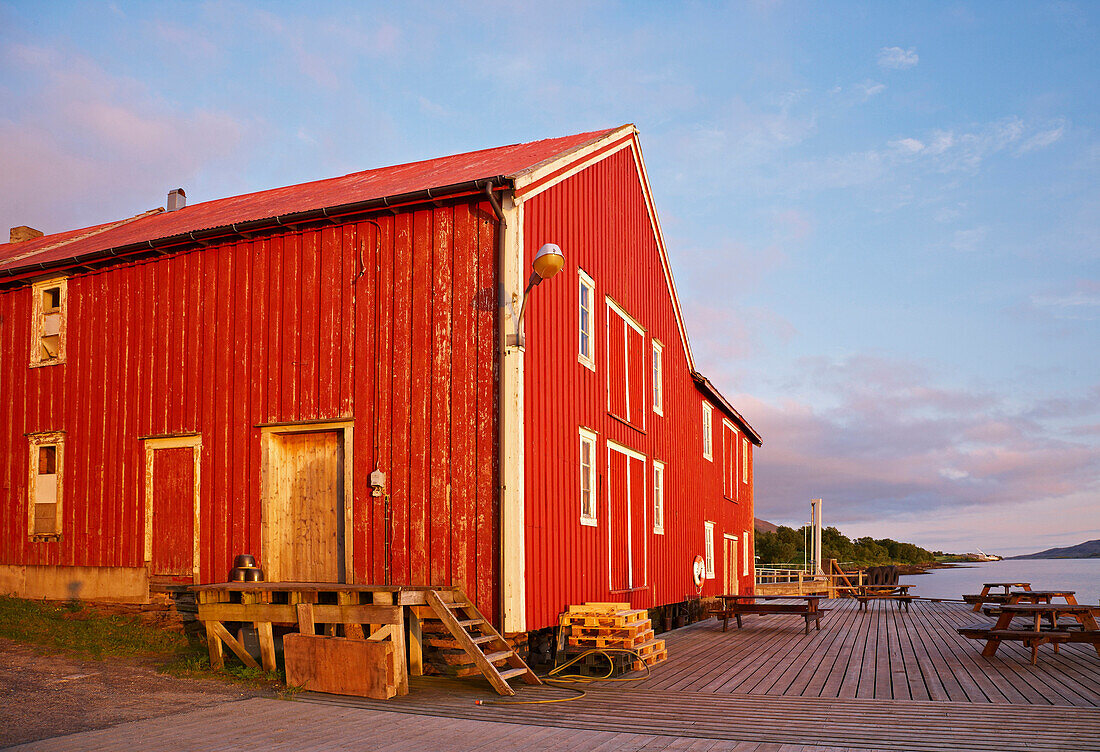 Red wooden house at Forvik ferry terminal, Vevelstad Sundet, Province of Nordland, Nordland, Norway, Europe