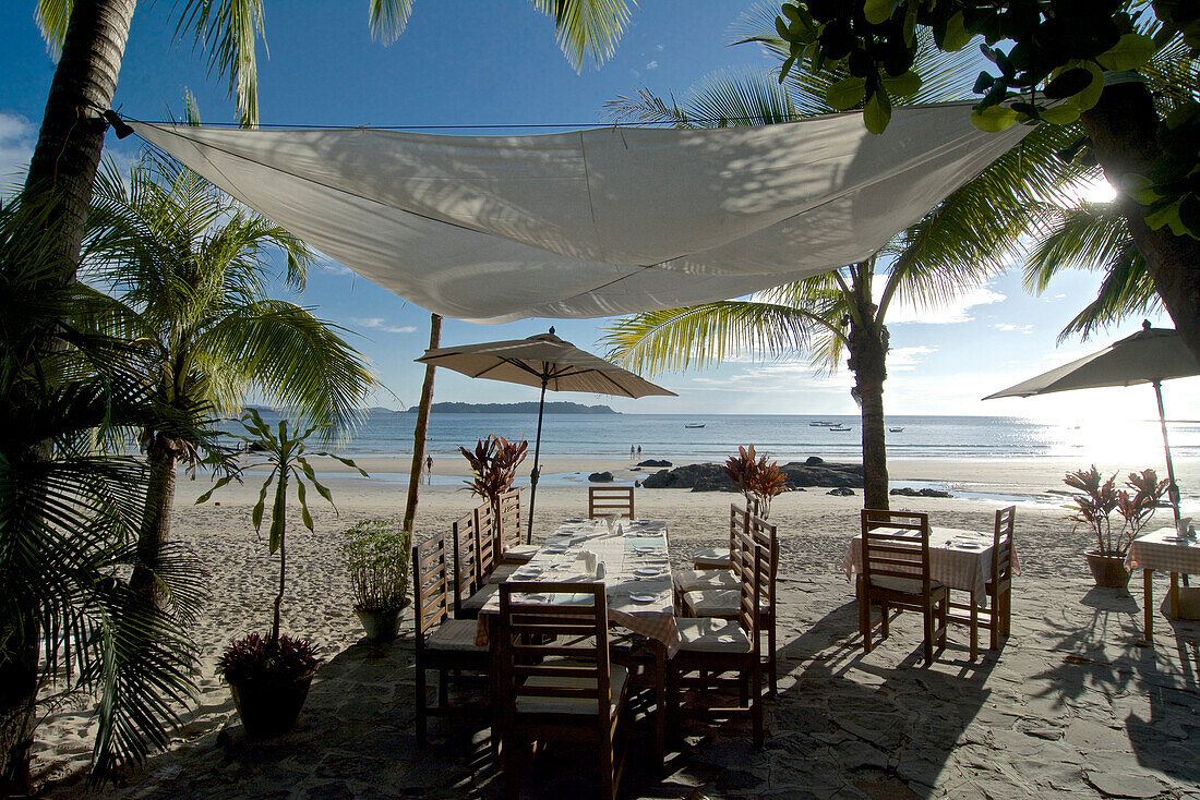 Dining tables under awning, Ngapali, most famous beach resort in Burma at the Bay of Bengal, Rakhaing State, Arakan, Myanmar, Burma