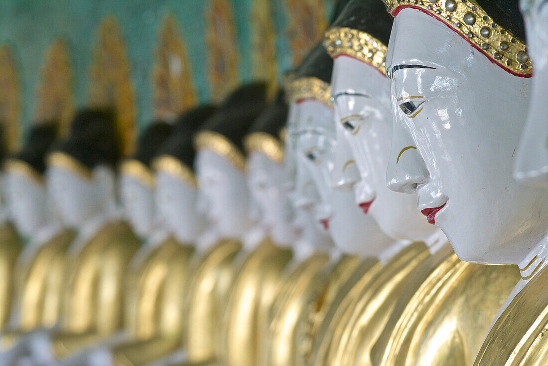 Buddha statues in the Oohmin Thonze pagoda, Sagaing Hill on the banks of the Irrawaddy river, 20km from Mandalay, Myanmar, Burma