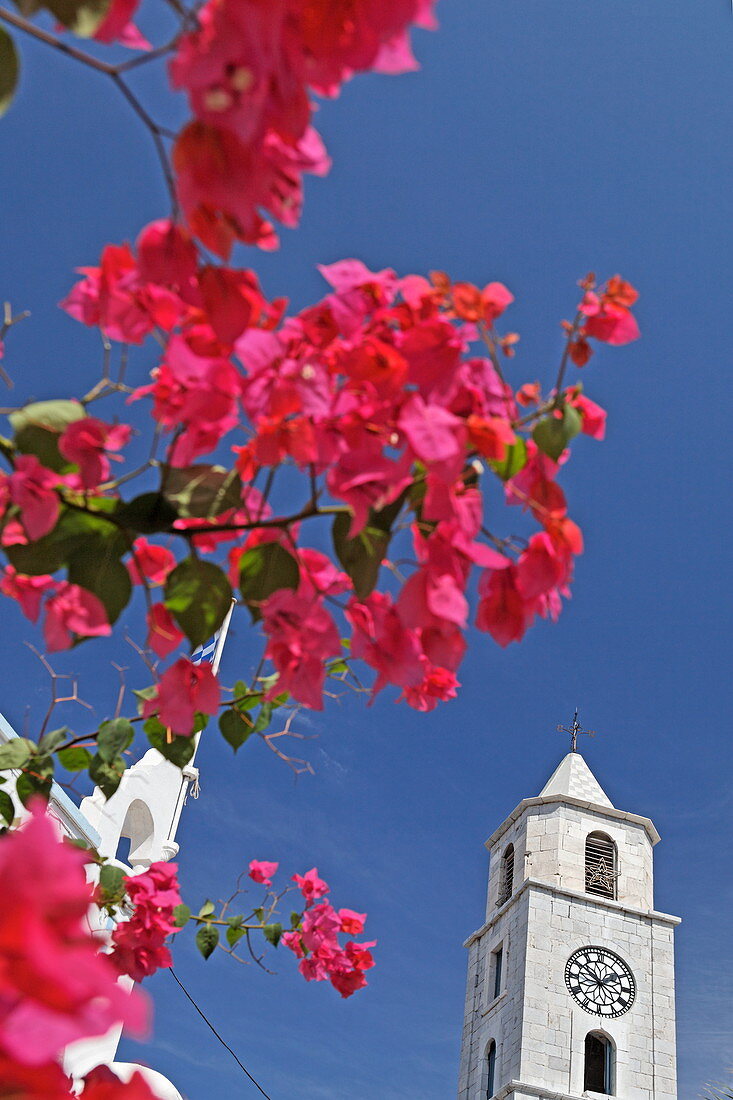 Clocktower at the entrance of Gialos harbour, Symi Town, Symi, Dodecanese, South Aegean, Greece