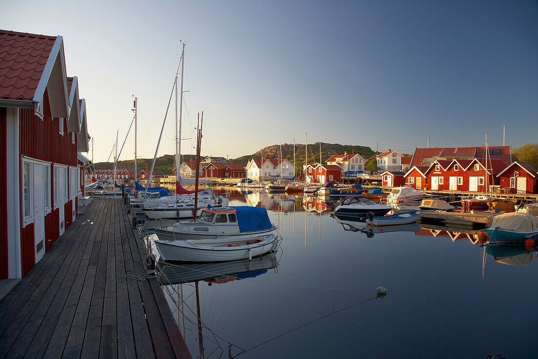 Boats and boot houses in Bleket port, Tjoern Island, Province of Bohuslaen, West coast, Sweden, Europe