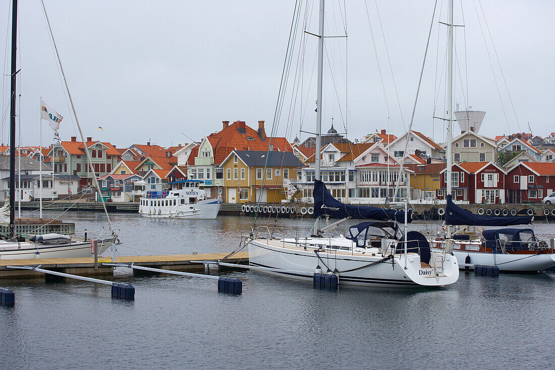 Boats and boat houses in the port of Smoegen, Sotenas Peninsula, Province of Bohuslaen, West coast, Sweden, Europe