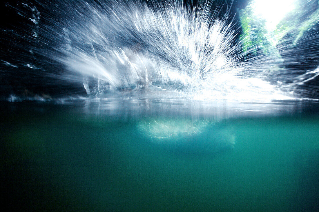 Man diving into a river, Denpasar, Bali, Indonesia