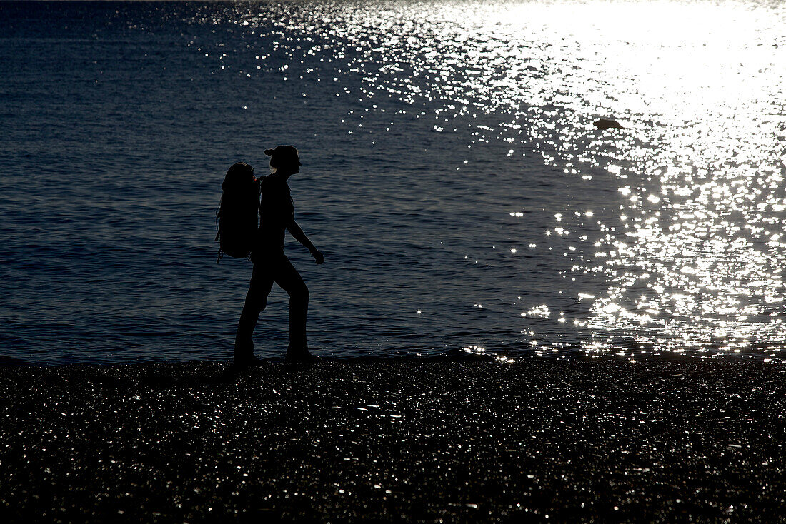 Woman hiking along long-distance footpath Lycian Way, Antalya, Turkey