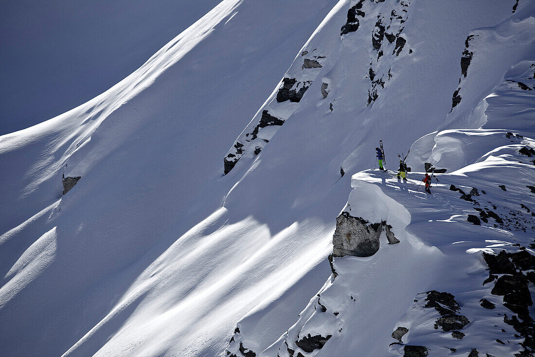 Three freeskier ascending, Chandolin, Canton of Valais, Switzerland