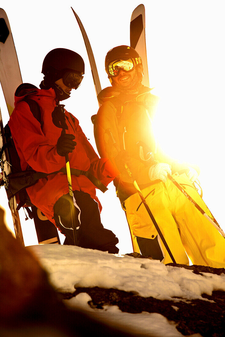Two freeskiers standing on the top of a mountain, Chandolin, Canton of Valais, Switzerland