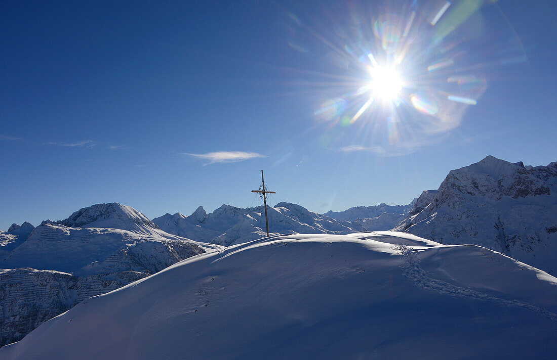 Summit cross in the skiing area of Lech in Arlberg, Winter in Vorarlberg, Austria