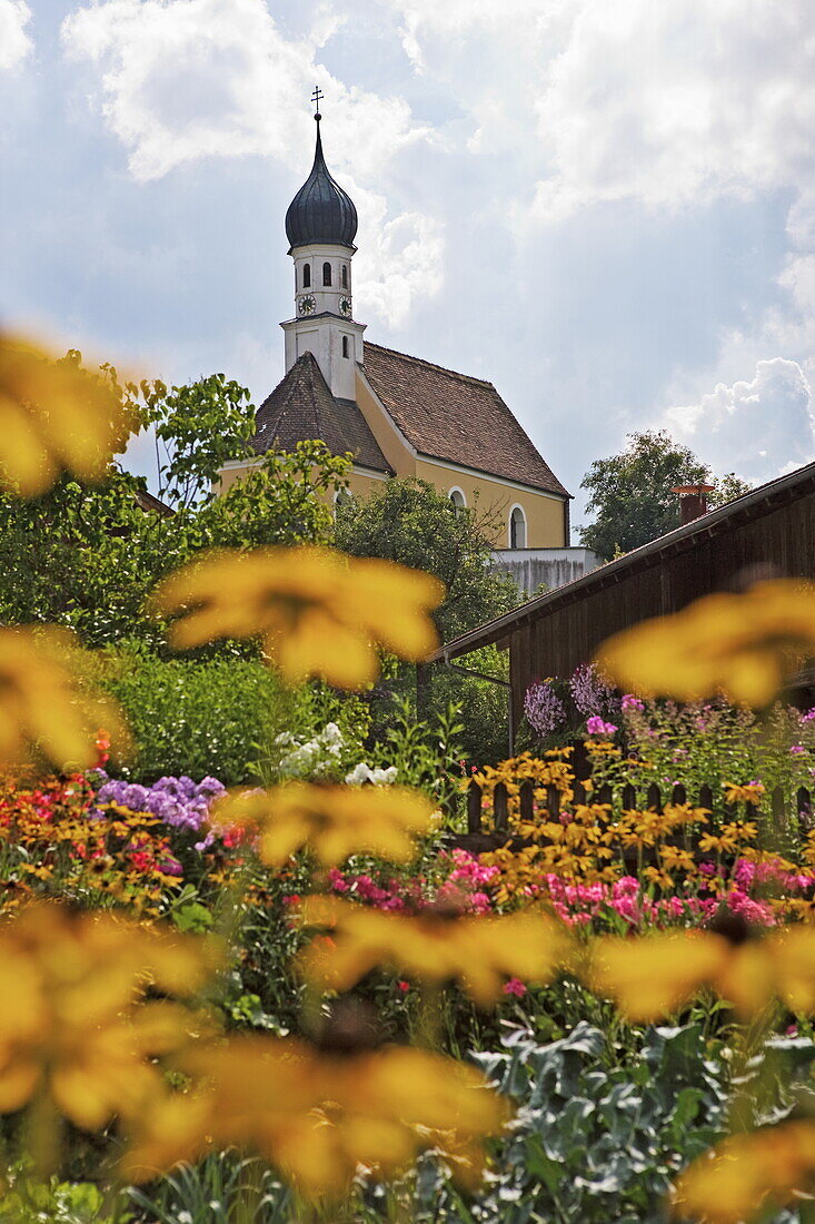 Traditional cottage garden and church, Jenhausen, Upper Bavaria, Bavaria, Germany