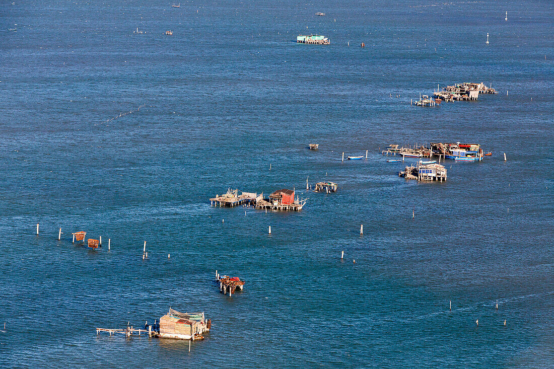 Aerial view of islands in the Venetian lagoon, Casone, Fishing huts on stilts, Pellestrina, Mediterranian Sea, Veneto, Italy