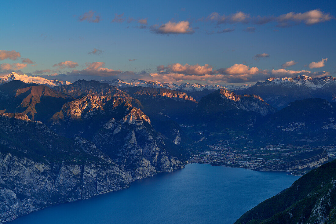 Lake Garda with Riva and view to Lake Garda range, Adamello range, Presanella range, Brenta range and valley of Sarca, Ventrar, Monte Baldo, Lake Garda range, Trentino, Italy