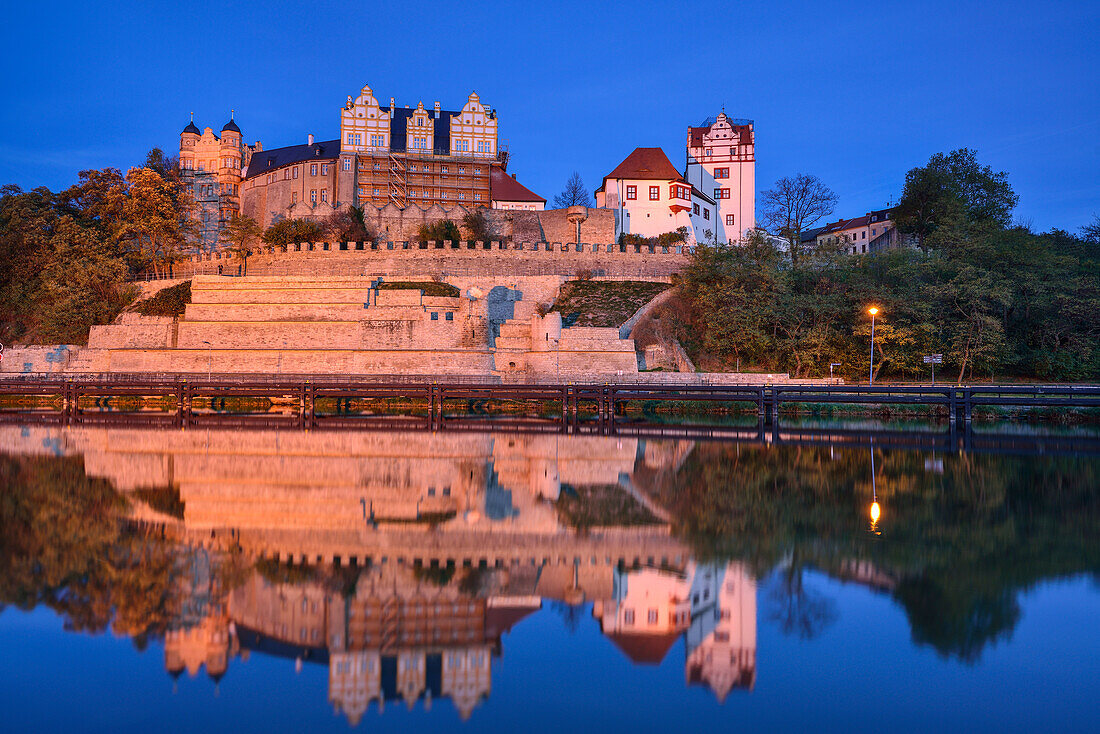 Illuminated Bernburg castle above the river Saale, Bernburg, Saxony-Anhalt, Germany