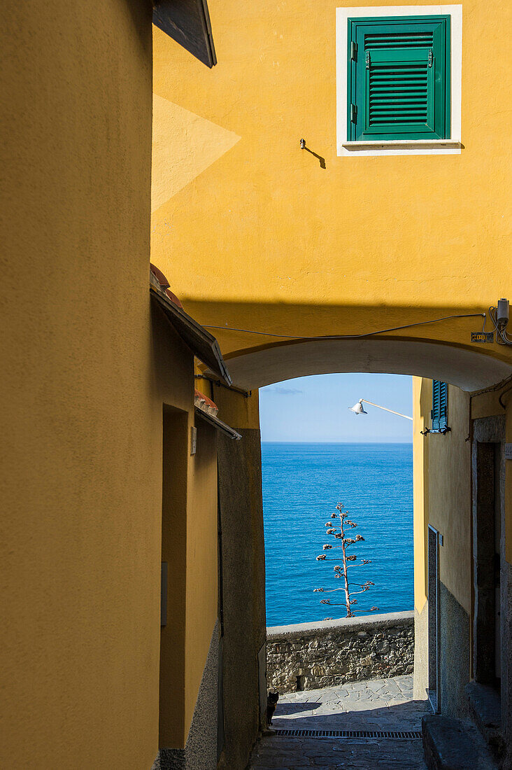 View through an archway to the sea, Corniglia, Cinque Terre, La Spezia, Liguria, Italy
