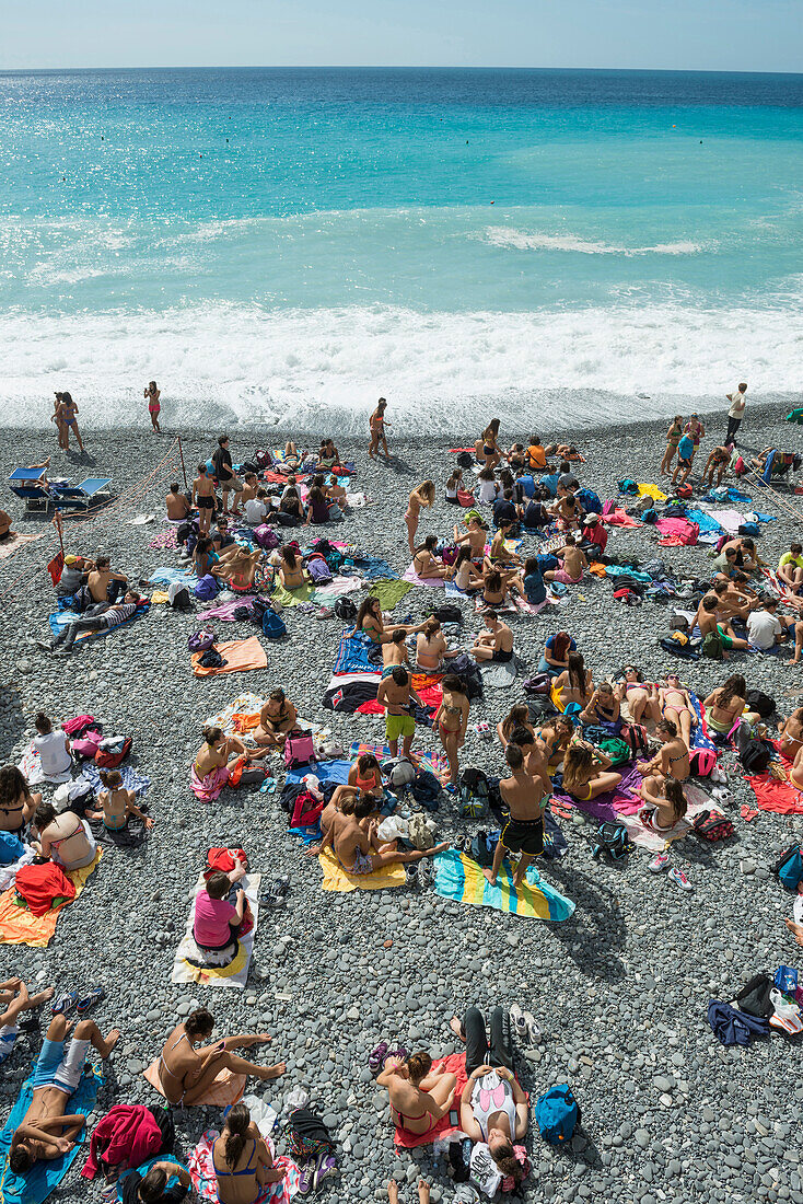 Sunbathing at beach, Camogli, province of Genua, Italian Riviera, Liguria, Italia