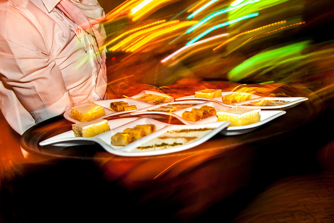 Waiter with typical turkish desserts, Istanbul, Turkey