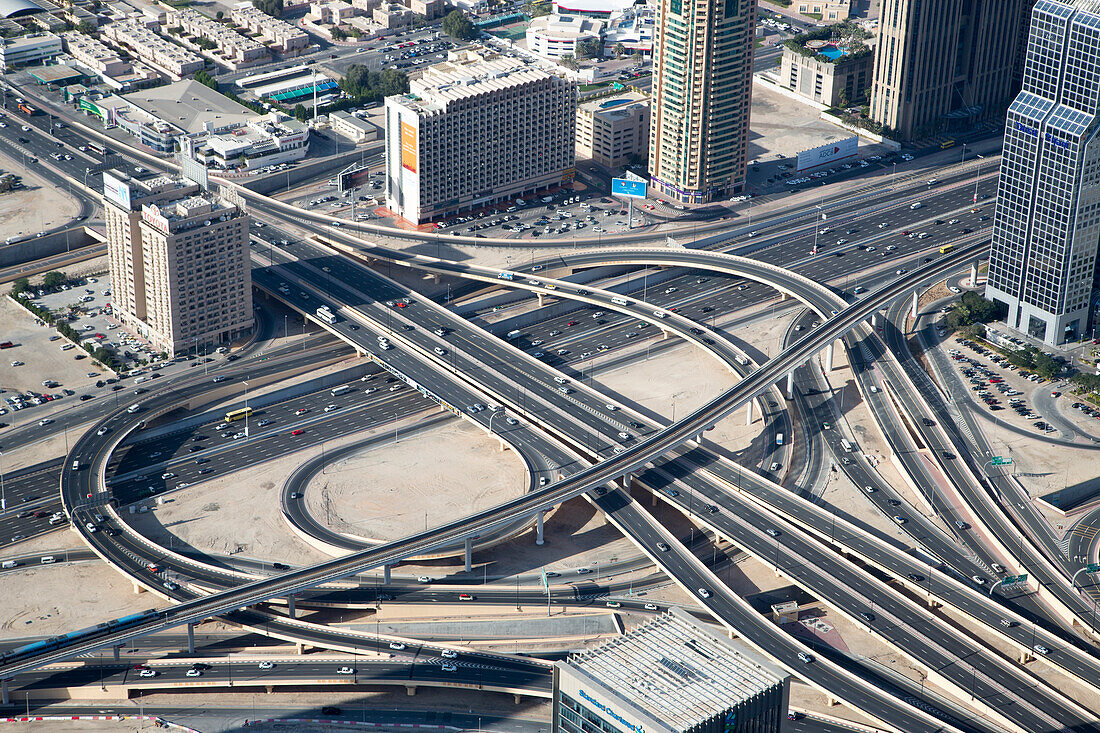 View of traffic interchange 1 of Sheikh Zayed Road and Doha Street from At The Top observation deck on level 124 of Burj Khalifa tower, Dubai, United Arab Emirates