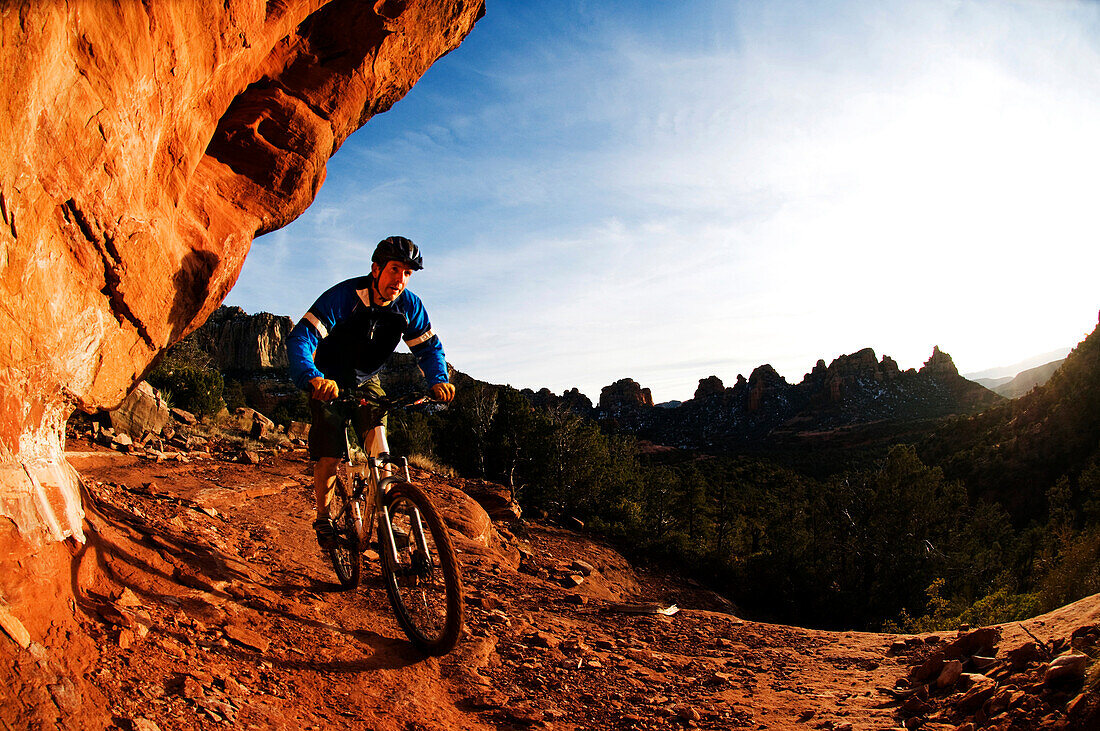A man taking a bike ride on a rocky trail Sedona, AZ, USA