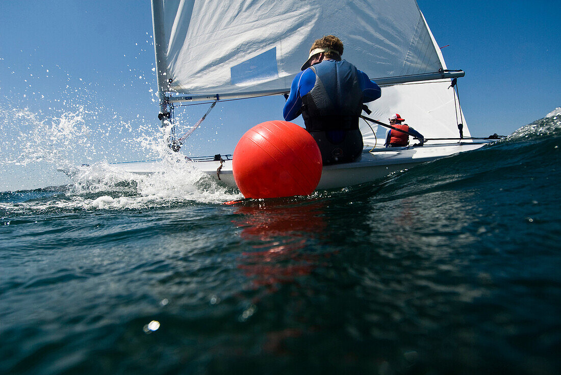 Two male athletes rounding a mark during Laser training in La Cruz, Mexico, La Cruz, Mexico