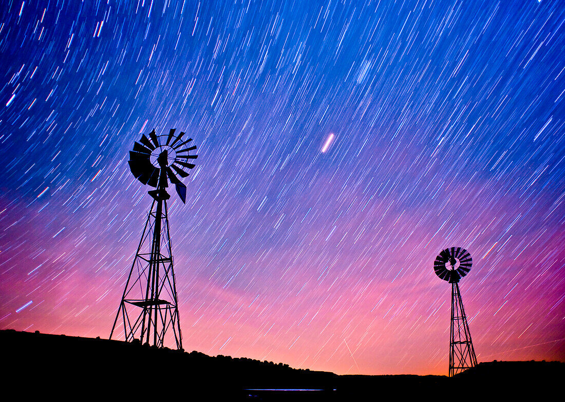 Two windmills with star trails in the sky.  La Junta, Colorado La Junta, Colorado, United States