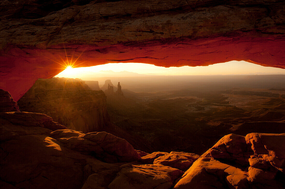 Rock arch with sun and canyon.   Canyonlands National Park, Moab, Utah Moab, Utah, United States