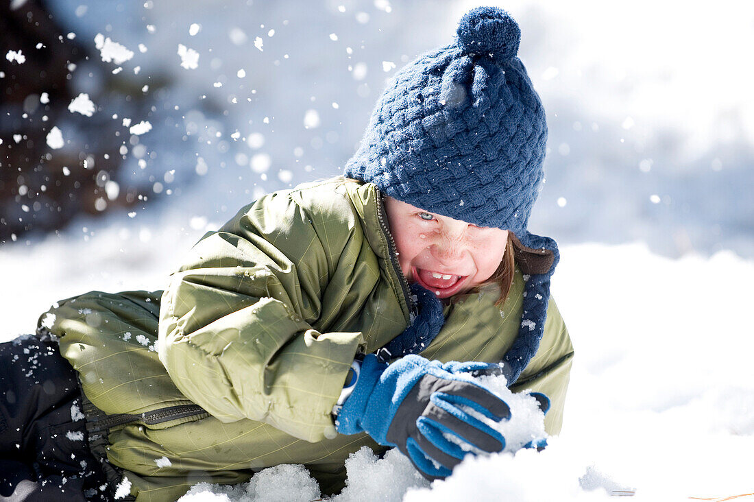 A boy plays in the snow in Lake Tahoe, California Truckee, CA, USA