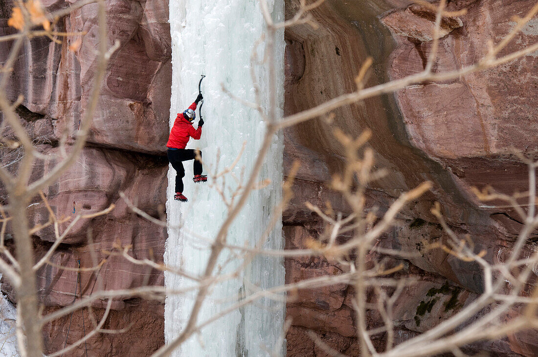 Man climbing ice pillar without a rope, Redstone, Colorado Redstone, Colorado, USA