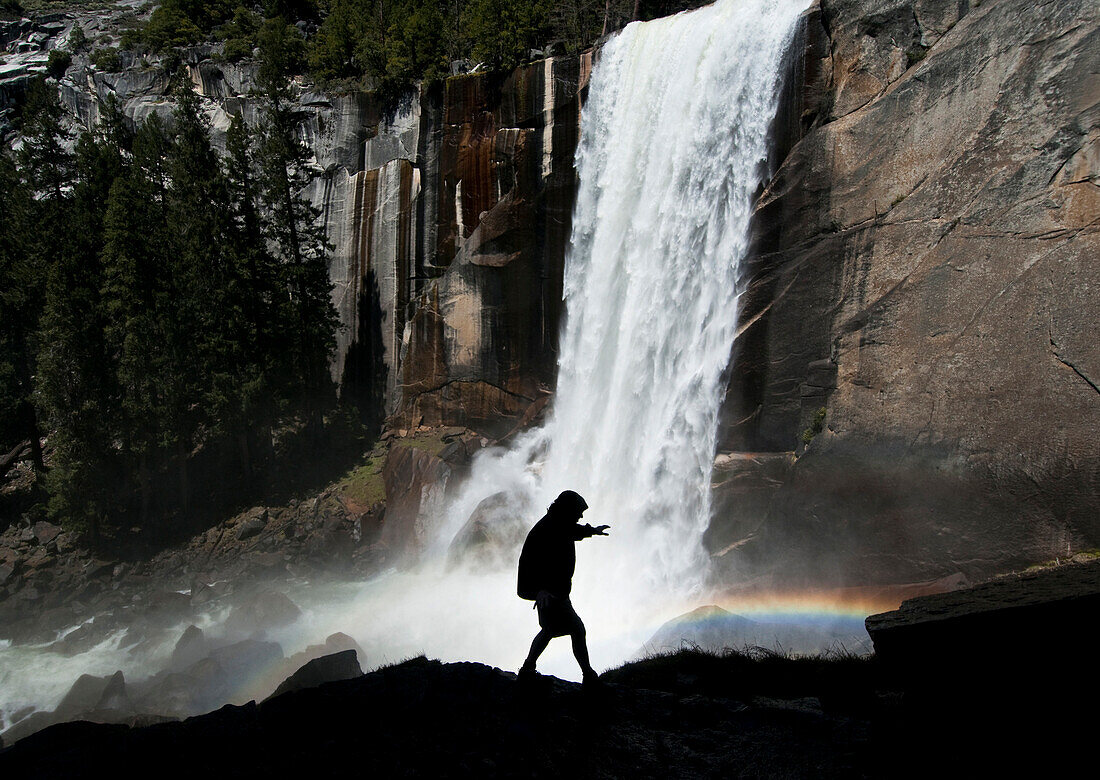 A man hikes along the Mist Trail to Vernal Fall in Yosemite National Park, California Yosemite, California, USA