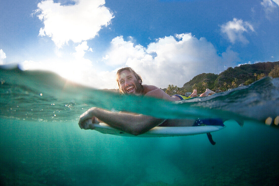A split level view of a surfer at Monster Mush, on the north shore of Oahu, Hawaii, north shore, Oahu, Hawaii, USA