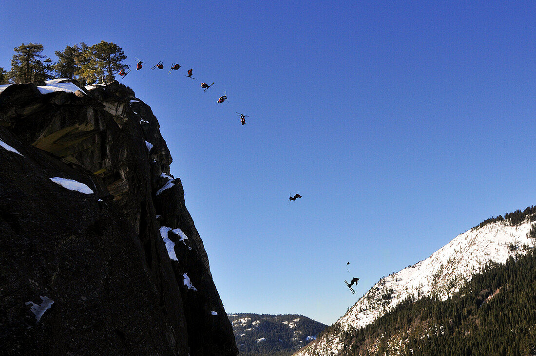Pro skier Josh Daiek performs a double backflip ski BASE jumping off of Lovers Leap in Strawberry, CA Strawberry, California, USA