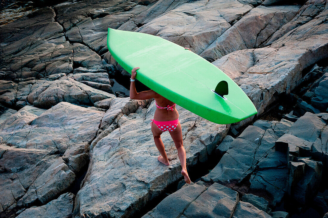 A woman enjoys her stand up paddle board USA