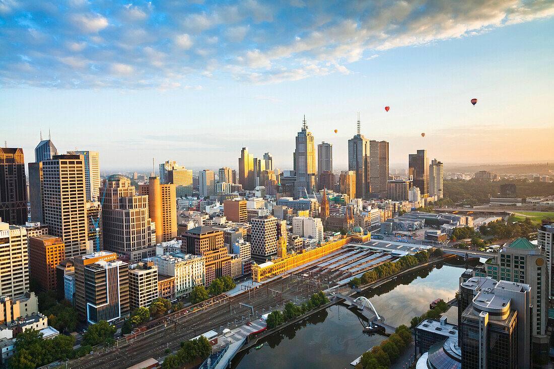 Hot air balloons aloft over Melbourne city at dawn, Victoria, Australia., Melbourne, Victoria, Australia