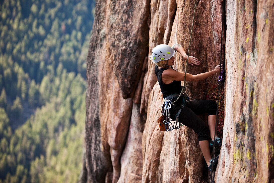 A athletic woman rock climbing near Bozeman, Montana., Bozeman, Montana, USA