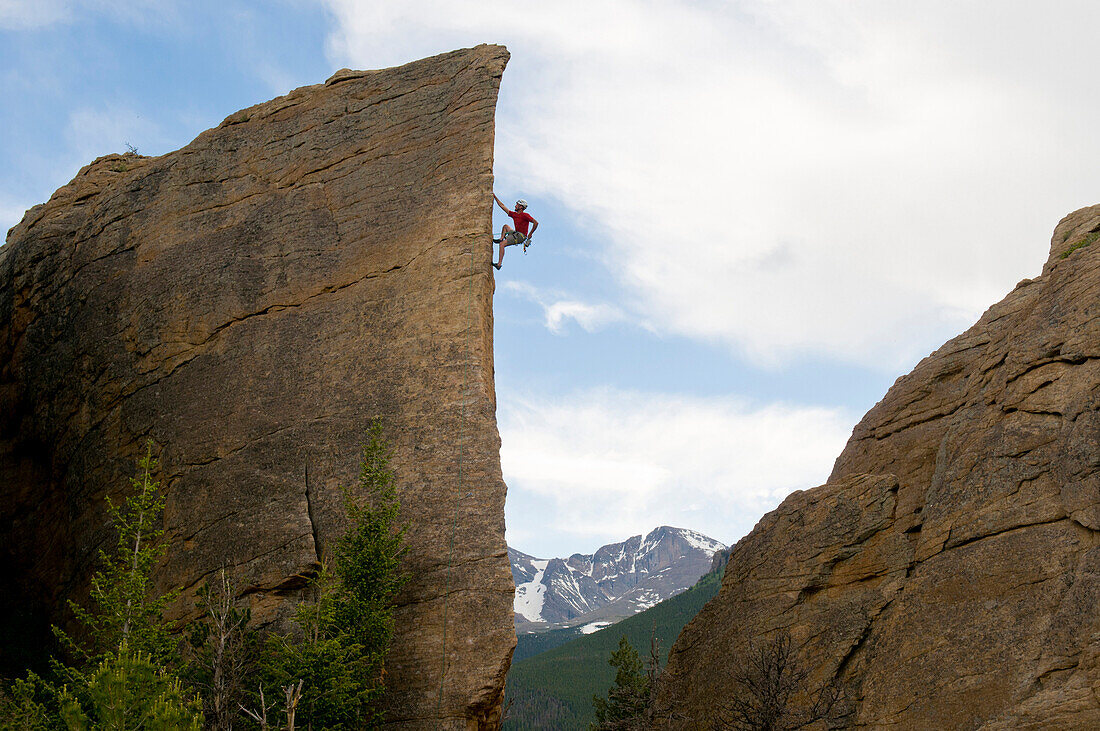 A man climbing a rock arete in  Rocky Mountain National Park, Estes Park, Colorado., Estes Park, Colorado, usa
