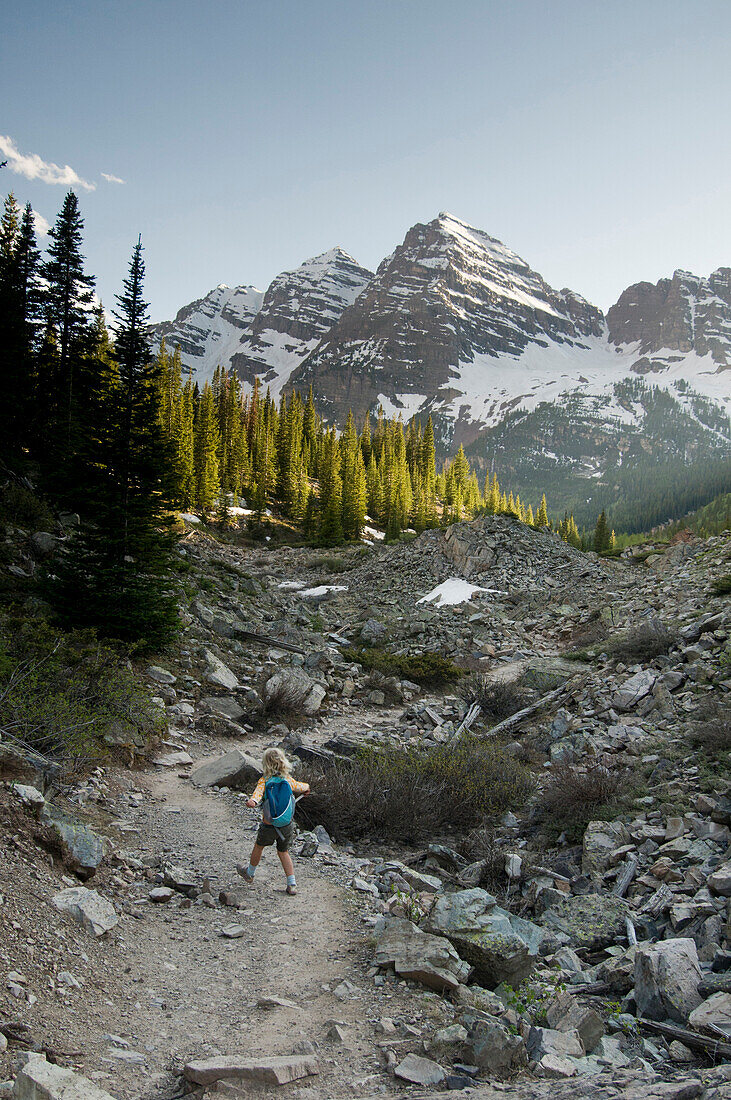 A young girl hiking trail to  Crater Lake, Maroon Bells Wilderness, Aspen, Colorado., Aspen, Colorado, usa