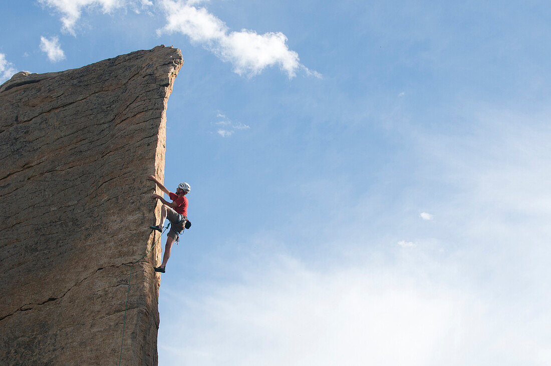 A man climbing a rock arete in  Rocky Mountain National Park, Estes Park, Colorado., Estes Park, Colorado, usa