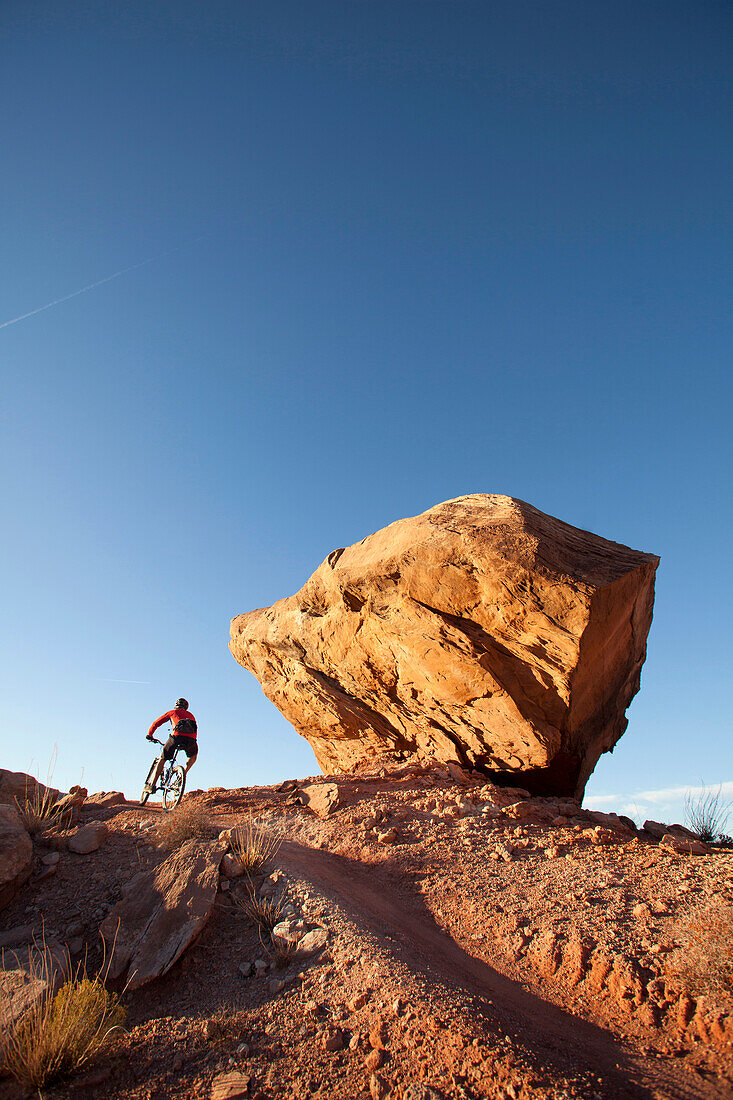 'Man mountain biking the ''North 40'' trail near the Bar M area. Moab, Utah., Moab, Utah, USA'