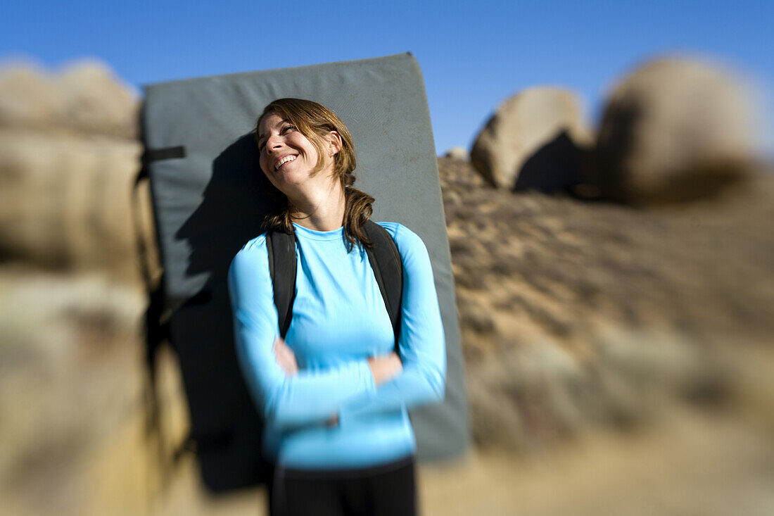 Woman smiling with her crash pad Bishop, California, United States