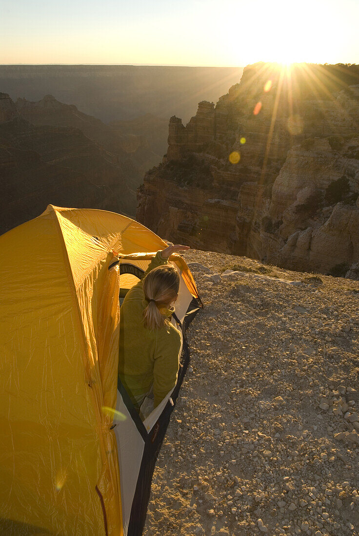 Woman camps in tent, Grand Canyon Arizona, United States