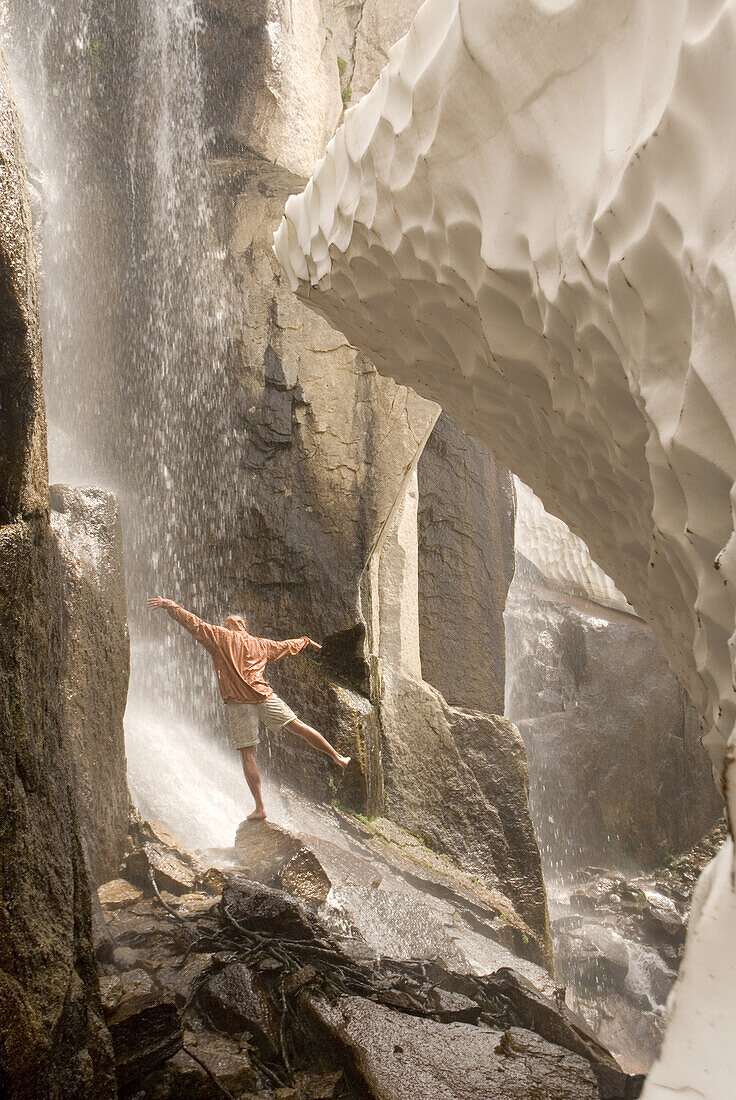 Hiker under waterfall Bridgeport, California, United States