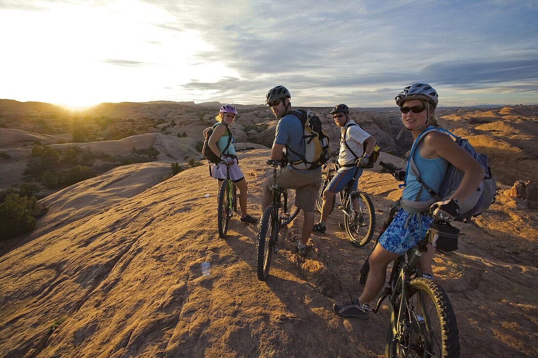 group taking a break while mountain biking in Moab, Utah, Moab, Utah, United States