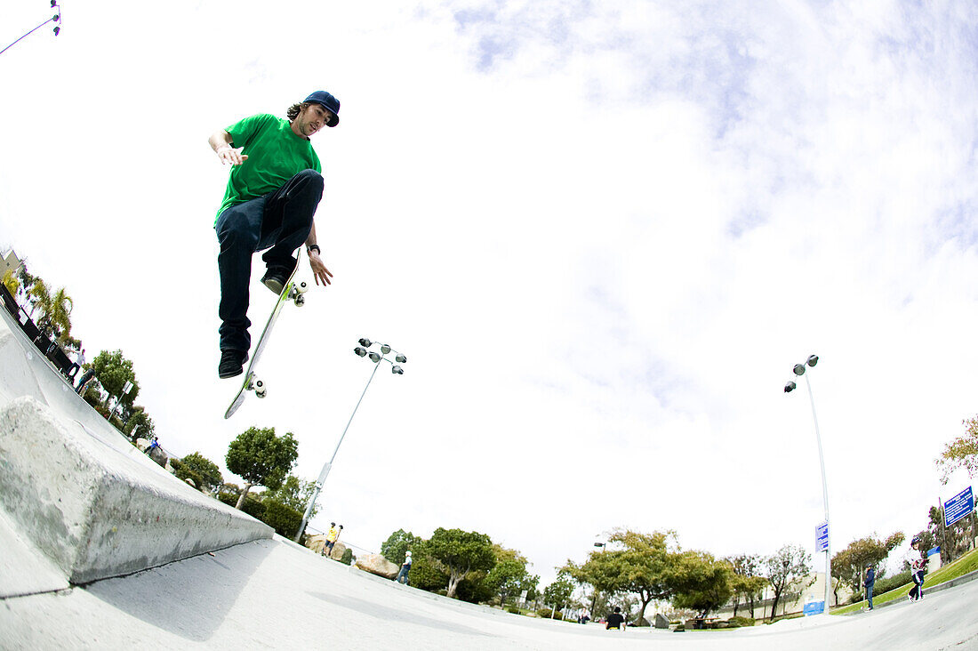 A skateboarder does a trick at the skatepark Carlsbad, California, United States