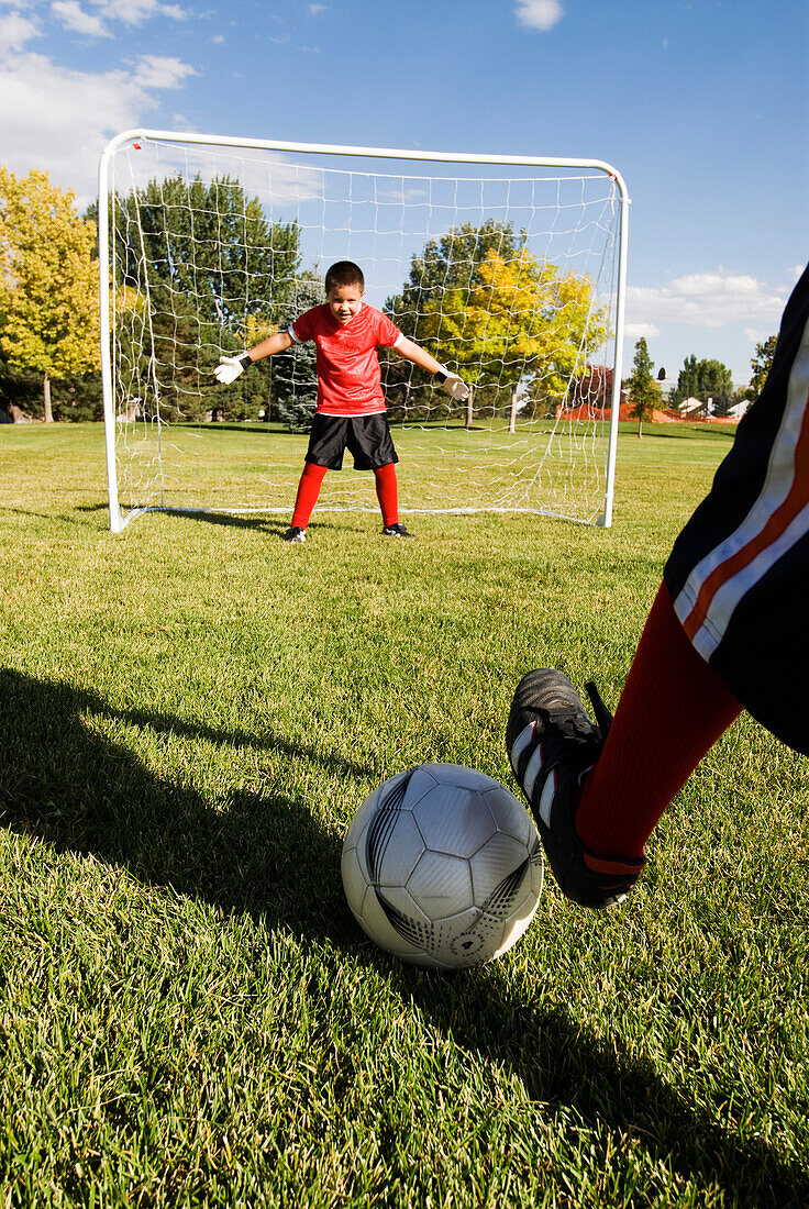 A boy stands ready to block the shot in a soccer game, Fort Collins, Colorado Fort Collins, Colorado, USA
