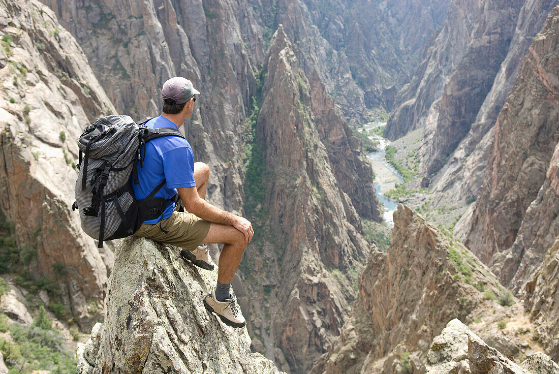 Man hiking on the North Rim of the Black Canyon of the Gunnison, Colorado Crawford, Colorado, USA