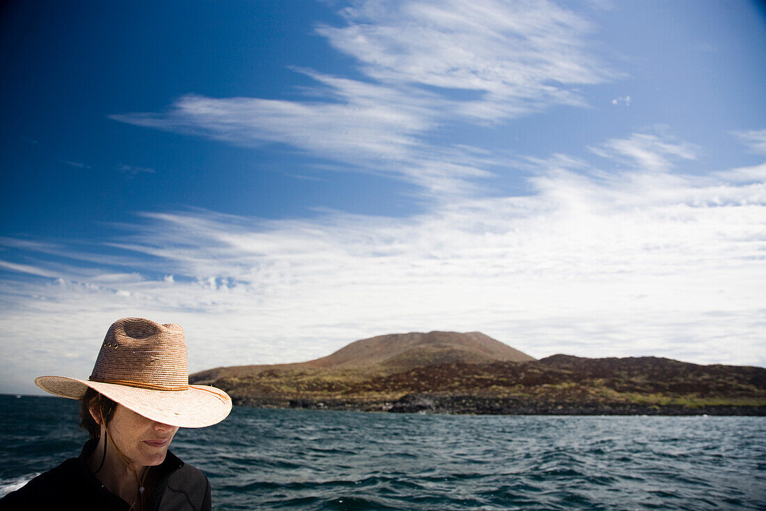 A woman sits on a boat while on the Sea of Cortes in Loreto, Baja California Sur, Mexico Loreto, Baja, Mexico