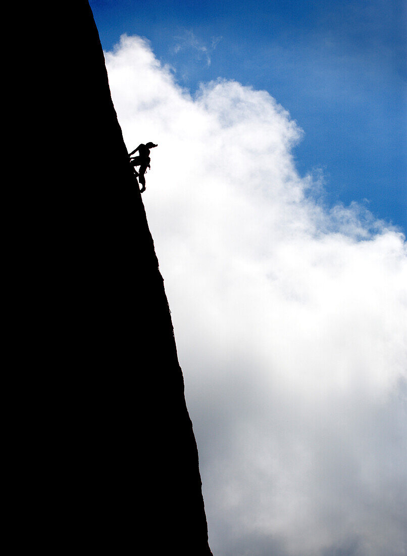Climber on a rock in Sardinia, Italy, Sardinia, Italy