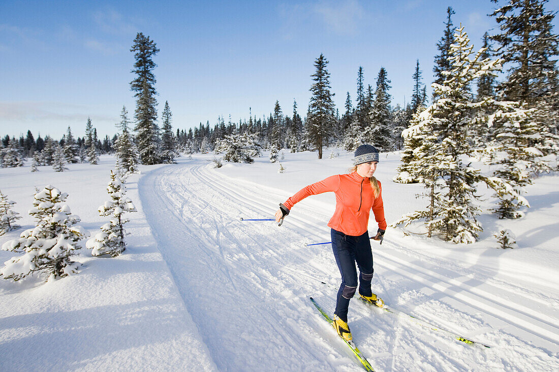 A young woman cross-country skiing Homer, Alaska, USA